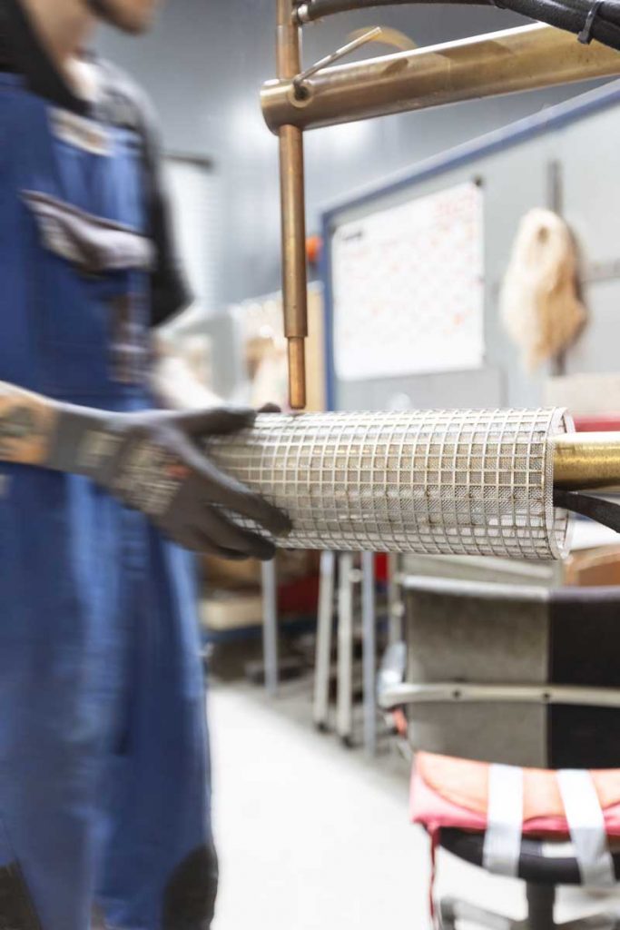 Screens, strainer baskets and profiles being tack-welded in strainer manufacturing