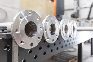 Stainless steel pipes with flanges in pipe fabrication for different custom connections on strainers and strainer units