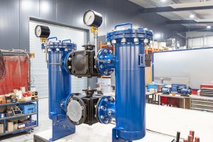 Duplex strainer with ball valve, butterfly valves and differential pressure indicator for changeover without plant shutdown