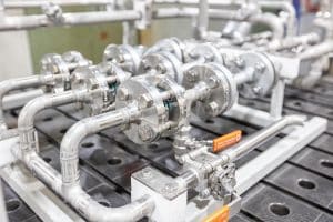 Stainless steel process plant in piping construction with angle seat valve, ball valve and Y strainer for steam and condensate on tyre presses